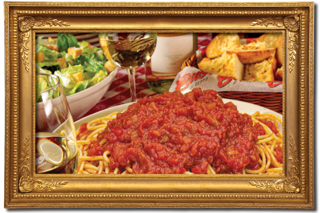 Spaghetti with marinara sauce, salad, and garlic bread